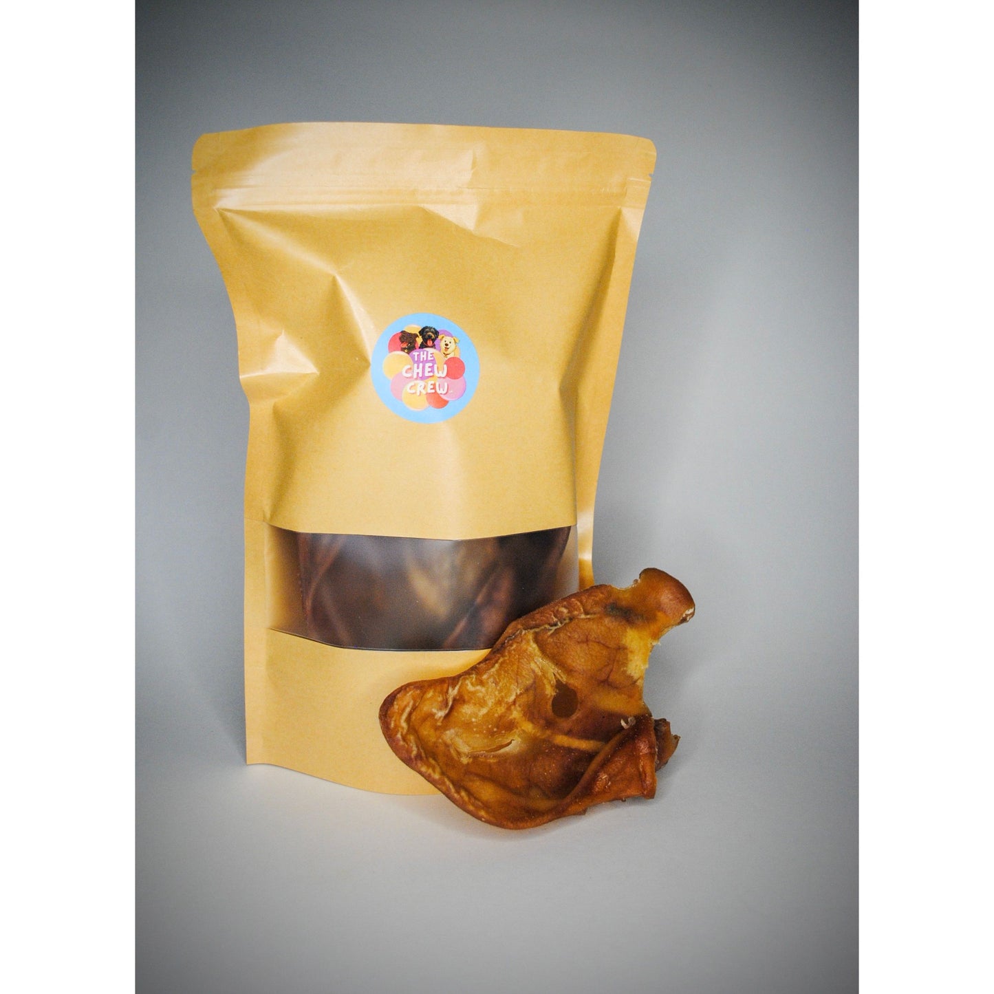 Yellow packaging bag with a dried product on a gray background