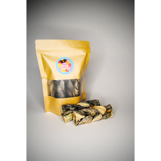 Yellow packaging bag with dried snacks on a grey background