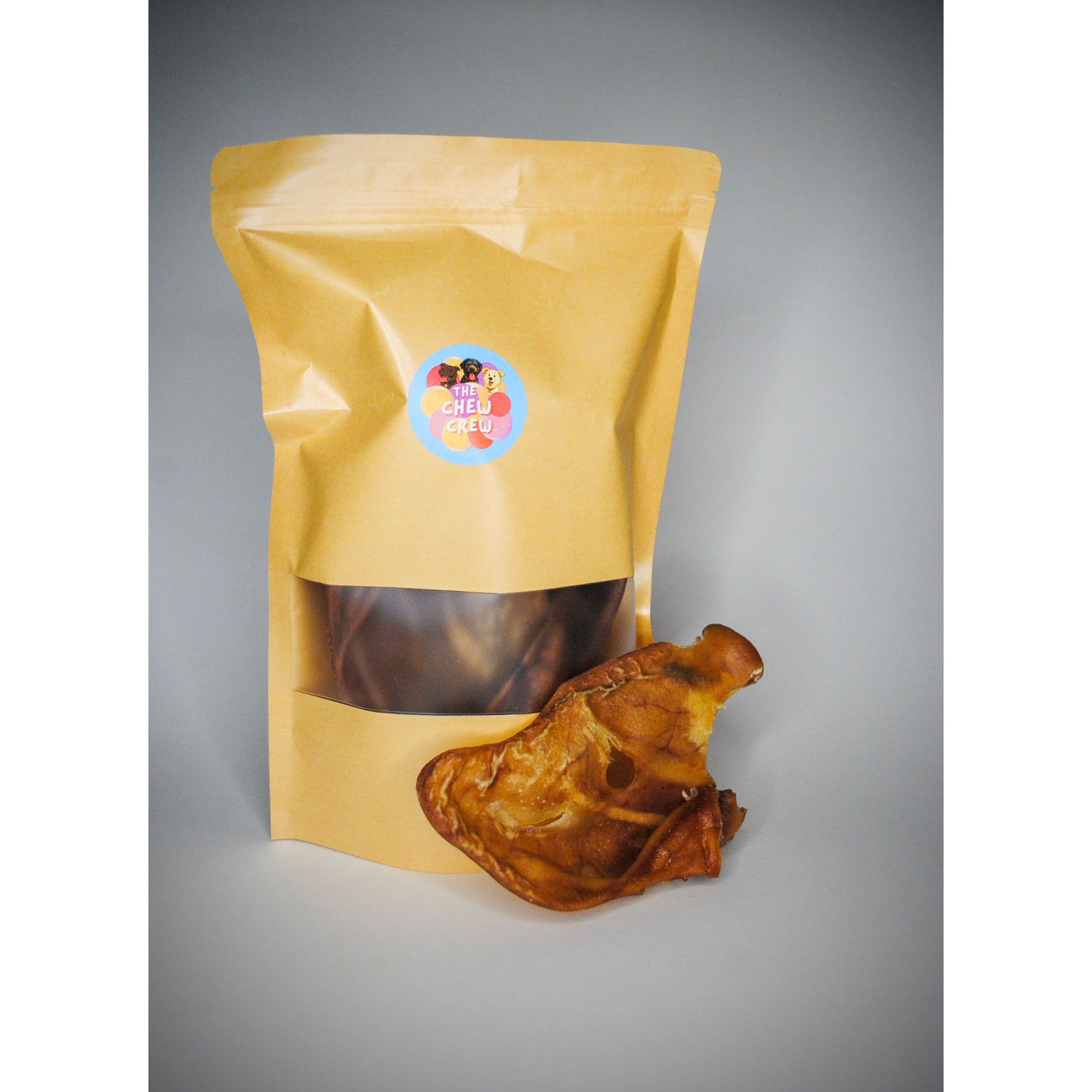 Yellow packaging bag with a dried product on a gray background
