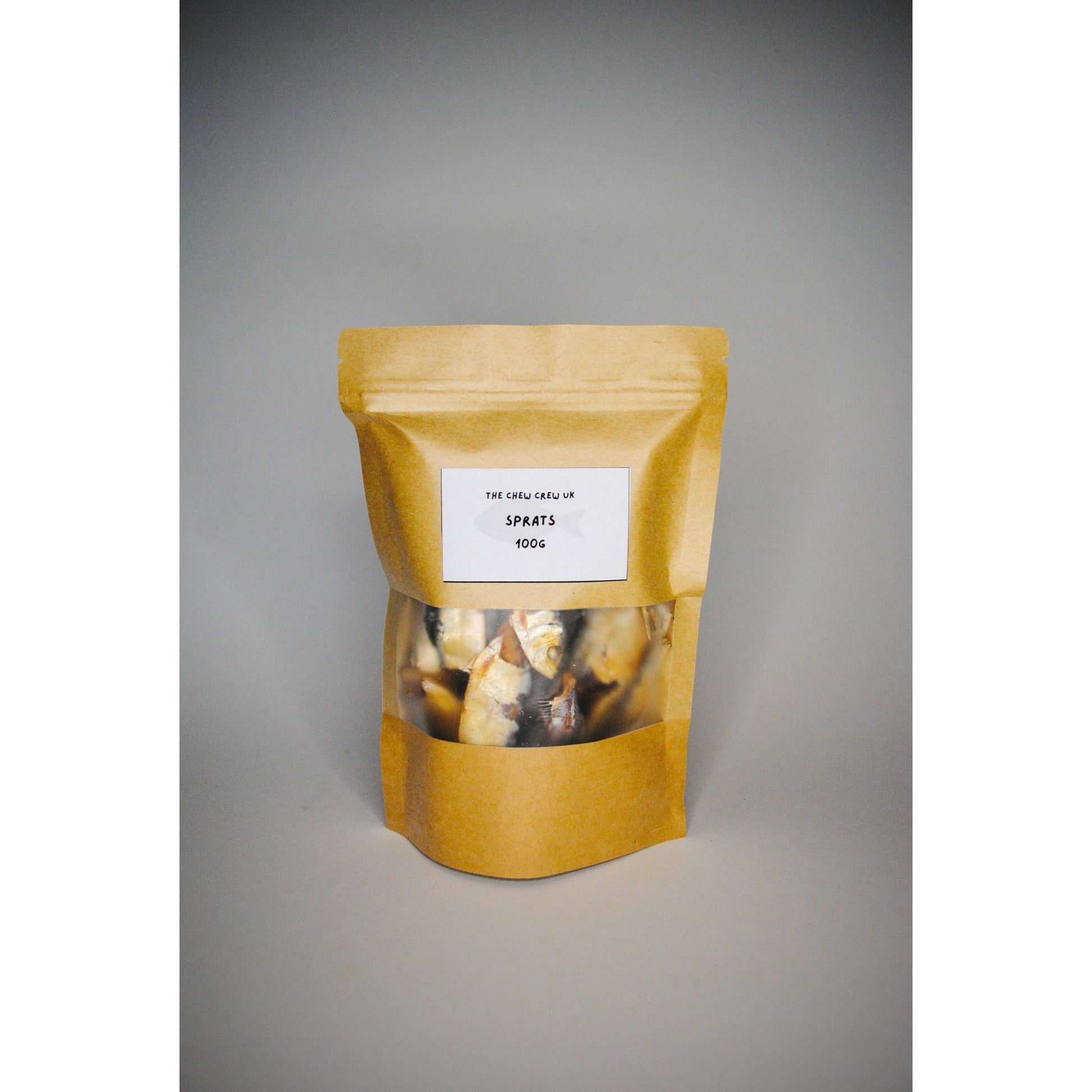 Yellow packaging with a clear window showing contents on a gray background