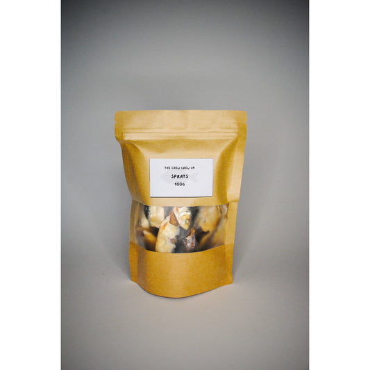 Yellow packaging with a clear window showing contents on a gray background